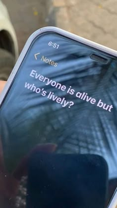 someone holding up their cell phone with the text everyone is alive but who's lively?