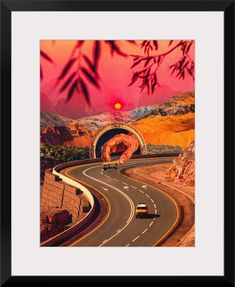 an image of a road going through a tunnel with mountains in the background at sunset