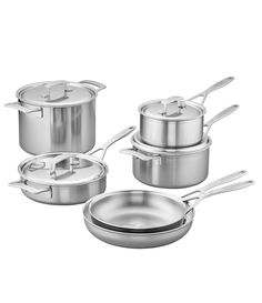 a set of pots and pans with lids