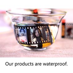 a glass bowl filled with pictures on top of a table next to other items and text that reads, our products are waterproof