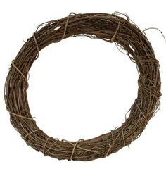 a round wreath made out of twigs on a white background