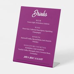 a purple menu card sitting on top of a table