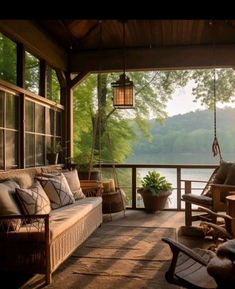 the porch is covered with lots of furniture and hanging lanterns on it's sides