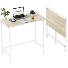 a desk with a laptop and monitor on it