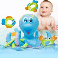 a baby is playing with toys in the water