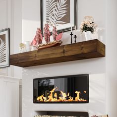 a fire place in a living room filled with furniture and decor on top of a mantle