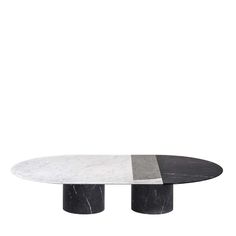 an oval marble table with two black and white pedestals on each side, against a white background