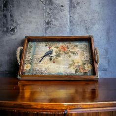 an old wooden box with a bird painted on it