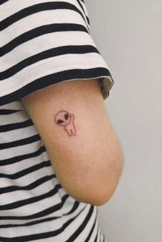 a woman with a small tattoo on her arm