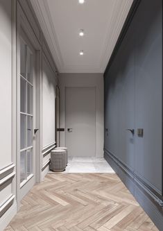 an empty hallway with white walls and wood flooring is pictured in this rendering image