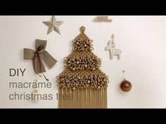 a christmas tree made out of macrame beads and other ornaments on a white background