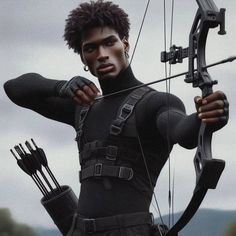 a man dressed in black holding a bow and arrow