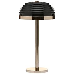 a black and chrome table lamp on a white background