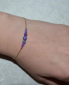 Gorgeous Sterling Silver bracelet with purple opal beads bar. This can be a perfect gift for you or your loved one! M a t e r i a l s Your bracelet can be made of the following materials: Sterling Silver or 14k Gold Filled. Please select material during checkout process. M e a s u r e m e n t s - Available bracelet lengths: 6, 6.5, 7, 7.5, 8 inches - The length of the entire bracelet is measured from end to end - Model on the pics wears 7 inches bracelet P a c k a g i n g Your order will be perf Glittery Accessories, Purple Opal, Jewelry Illustration, Silver Rings With Stones, Bracelet Minimalist, Bracelet Simple, Bar Bracelet, Tiffany Jewelry, Pretty Jewelry