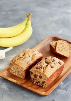 banana and chocolate chip muffins on a wooden plate