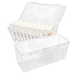 two plastic storage boxes with dividers on the top and bottom, one filled with small pieces