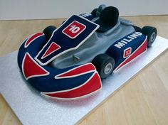 a birthday cake shaped like a race car