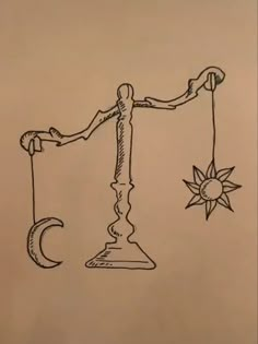 a drawing of a scale with the sun and moon on it, as well as a crescent