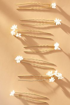 Enhance your hairstyle with the subtle sophistication of the Natural Pearl Hair Pins, each one a delicate adornment crafted to add a touch of timeless grace to your look. | Natural Pearl Hair Pins, Set of 7 by Anthropologie in White, Women's, Gold/Plated Brass Hair Pins And Clips, Unique Bridal Hair Accessories, Pearl Hair Accessories Wedding, Pearl Wedding Accessories, Hawaiian Hairstyles, Hair Acessories, Lace Burgundy Dress, Floral Hair Pins, Bridesmaid Hair Accessories