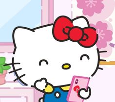 a hello kitty holding a cell phone in front of a potted plant and window