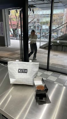 a white bag sitting on top of a metal counter