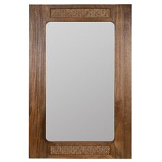 a wooden frame mirror with a white glass in the center and brown wood trim around it