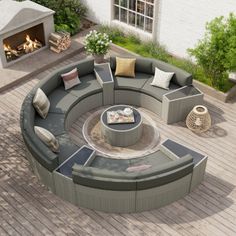 an outdoor fire pit surrounded by furniture