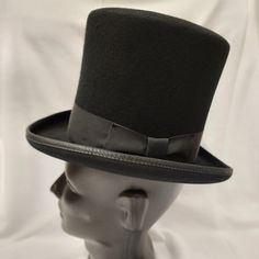 Broadway Quality, Made In Usa, 100% Wool Squire 6.25" Top Hat. Color: Black American / Nearest 1/8 Inch / Metric Cm / Size Code 6 3/4 21 1/8 54 Small 6 7/8 21 1/2 55 Small / Child L Broadway Quality Made In Usa By Hxc Hatcrafters Inc. These Hats Are Of High Quality And No Longer Manufactured So The Sizes And Quantity Available Are Finite. We Also Cannot Accept Lower Bids On These Hats As They Are Already At Reduced Prices. Classic Top Hat For Winter, Black Formal Boater Hat With Flat Brim, Formal Black Boater Hat With Flat Brim, Curved Brim Hats For Winter Derby, Black Brimmed Boater Hat For Formal Occasions, Curved Brim Derby Hat For Winter, Winter Derby Hats With Curved Brim, Black Top Hat With Short Brim For Formal Occasions, Black Mini Hat With Flat Brim For Formal Occasions