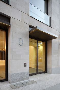 the entrance to an office building with glass doors