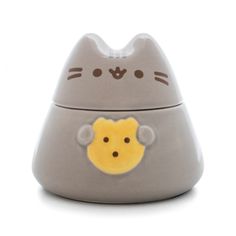 a gray cat shaped container with a yellow monkey on it