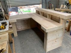 a work bench made out of plywood in a garage