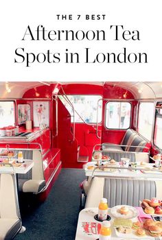 a red and white train car filled with tables covered in breakfast food next to windows