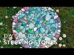 the words diy sea glass stepping stones are in front of some daisies