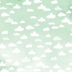 the sky is filled with white clouds on a green watercolored paper texture background