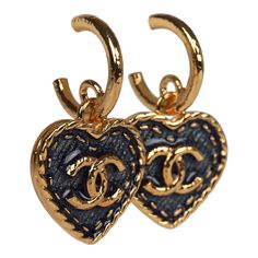 These Chanel CC denim heart earrings feature small gold tone metal CC hoops with a dangling gold and blue Denim enamel heart, with a gold tone CC in the center, and have post back earring closure. Origin: ItalyCondition: New and never wornAccompanied by: Box, felt jewelry cover, ribbon, carebook and retail UPC, Measurements: 1.5" (top of hoop to bottom of heart) x 1" (across heart) Gold Enamel Heart Charm Earrings, Vintage Chanel Jewelry, Brand Earrings, Denim Earrings, Fashion Moodboard, Dangle Earrings Gold, Felt Jewelry, Luxury Earrings, Gold And Blue