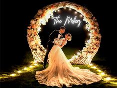 a bride and groom standing in front of a lighted sign that says the millers