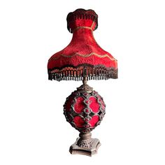 a red lamp sitting on top of a table