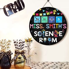 a black and white clock with the words miss smith's science room on it