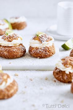 small pastries are sitting on a white tray