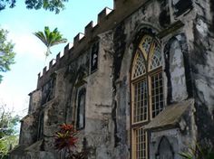 an old stone building with arched windows