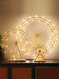 two ferris wheel lights on top of a table