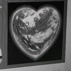 an image of a heart made out of the earth in black and white, on a computer screen