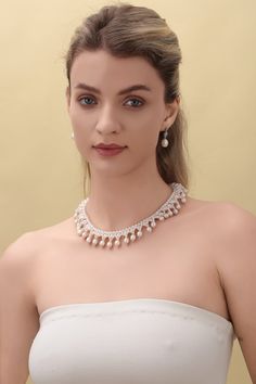 Embrace the opulence of our Vintage Triple-Layer Handcrafted Pearl Necklace, ideal for banquets and weddings. This exquisite piece features three sizes of near-round and oval-shaped pearls, meticulously handcrafted into a luxurious three-layer design. The necklace measures 40cm with an additional 5cm extension, offering flexibility and a perfect fit for any formal attire. Product Details: Pearl Types: Various Sizes, Near-Round and Oval Shapes Craftsmanship: Pure Handcrafted Style: Vintage Luxury Length: 40cm + 5cm Extension Occasion: Perfect for Banquets, Weddings Design: Triple-Layer Pearls This necklace's classic styling and intricate handcrafting make it a stunning choice for anyone looking to add a touch of vintage elegance and grandeur to their ensemble. Product Information Pearl Type Elegant Pearl Embellished Jewelry, Pearl White Jewelry With Pearl Chain For Formal Occasions, Formal Pearl White Jewelry With Pearl Chain, Elegant Oval Bridal Necklace For Formal Occasions, Graceful Pearl Jewelry For Party, Luxury Pearl Drop Necklace For Evening, Luxury Pearl Necklace For Evening, Elegant Oval Pearl Necklaces, Elegant Pearl-embellished Jewelry For Formal Events