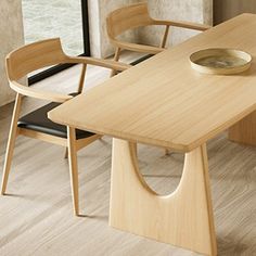 a wooden table with two chairs and a bowl on it in front of a window