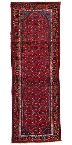 an antique persian rug with red and blue colors