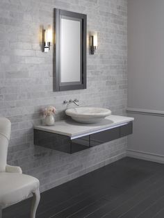 a bathroom with two sinks and a mirror on the wall