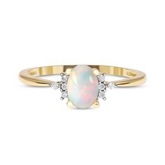 an opal and diamond ring in yellow gold