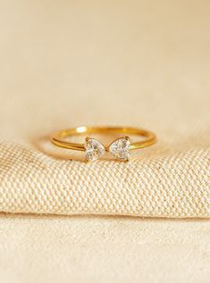 a diamond ring sitting on top of a cloth