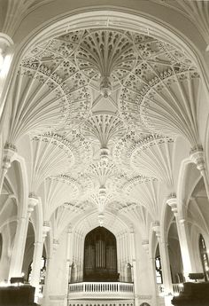 an ornate ceiling in the middle of a large building