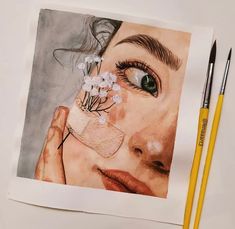 a drawing of a woman's face with flowers in her eye and two pencils next to it